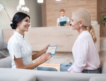 team member going over financial options with patient in Alpharetta