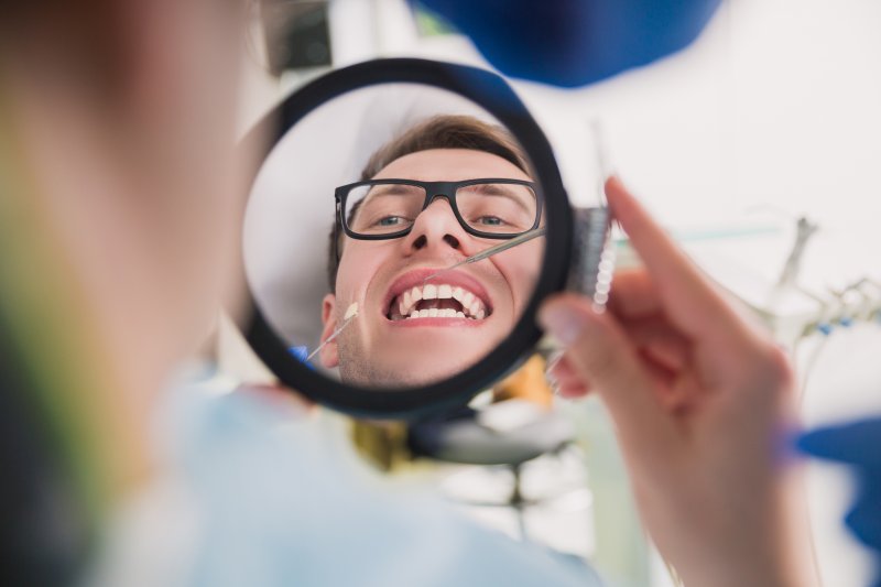 Patient asking dentist about the line under their dental crowns